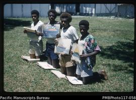 ‘Melai, Teti, Masingran and Roger with paintings, South West Bay District School’