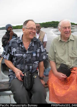 [Chris Gregory [left] and Bill Gammage [right] enroute to Bau with Emogi/Emosi Qelo and unknown]