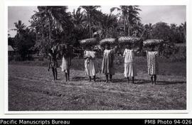 Group carrying woven baskets