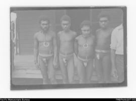 Kailang Bulukuk, unknown man, Aitur Mbwolgau, and another unknown man, of Kairolitlit, outside Wi...