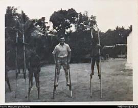 'Ahamb Oct. 1944', men on stilts