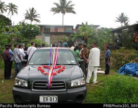 [Suva Wedding  The groom in wedding car at the bride's family home.]