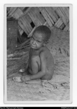Young boy sitting on woven mat, probably Malekula