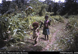 'On Gold Ridge, Guadalcanal' [Two children on the path]