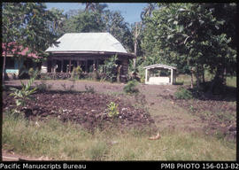House and grave of a family member, Upolu, Samoa