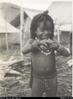 Child with shells, armlets and bilum, Kerawagi, Chimbu.