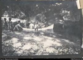 Group of people in rowing boat, Aulua, Malekula