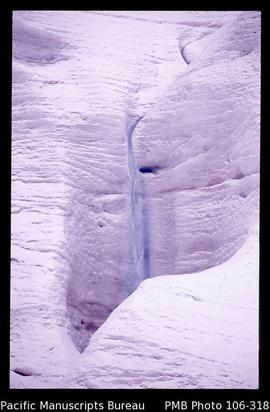 [Waterfall within the glacier, above Freeport’s Grasberg mine.]