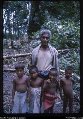 'One of the old Kukutin Village committee members with children, Wagina Island'