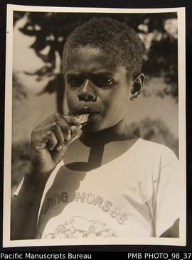 Boy with toy whistle