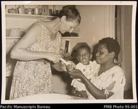 Mrs. Jessie Murray attending a small patient - Nguna
