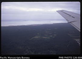 'Aerial view of farmed land on Tongatapu with Liahona on right side of photo, Tonga'