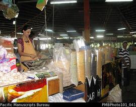 [Suva Woman selling blue peas, split peas etc in market]