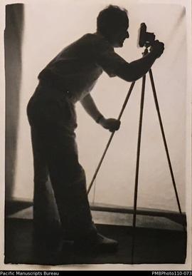 'Characteristic poses', Conrad Stallan behind camera on tripod.