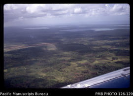 'Aerial views of Tongatapu from Fua'amotu looking over lagoon to Nuku'alofa, Tonga'