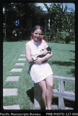 'Liz and cat Doka in garden of 30 Beach Road, Suva, Fiji'