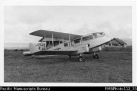 [untitled] [Humilaveka? Eastern Highlands District, biplane De Havilland 84 Dragon; on left two E...