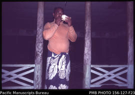 Announcing and policing an evening curfew ordered by the fono, Upolu, Samoa