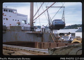 'Closeup of car being lifted from hold of MV Ellice Maru, Fiji'