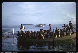 'Lighter unloading MV Myrtle's passengers at creek, Kukutin village, Wagina Island'