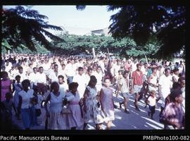 "Crowd in Good Friday Easter procession, Honiara, following Jesus carrying cross. Lavinia (G...