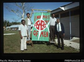 'Pastors R. Tiama, Willie Oli, Pakoa and Silas with banner, Talua'