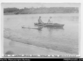 Mrs Paton with Rio in canoe, Santo Beach, Tangoa in background