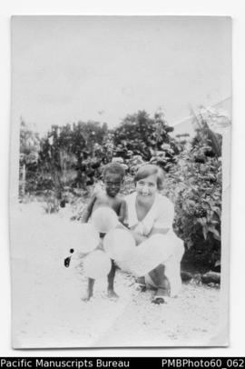 Alice with a ni-Vanuatu child on Christmas Day