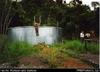 At new tank supplied and installed under the project, Buimo Correctional Institution, outside Lae...