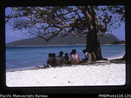 'Bible Study group on beach, Pele. Nguna behind.'