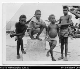 ni-Vanuatu boys by tombstone