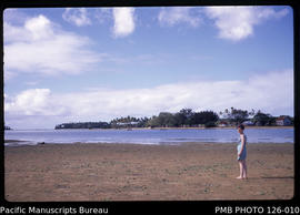 'Liz Baker on exposed sands with Nukunuku Island behind, Tonga'