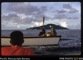 'Punt en route for Cikobia Island, with MV Komaiwai and Munia Island in background, Fiji'