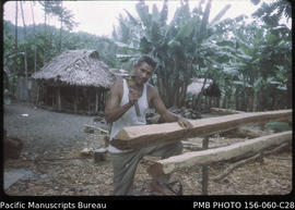 Carpenter preparing house timber, Upolu, Samoa