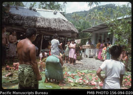 Leading matai far left supervises distribution, Upolu, Samoa