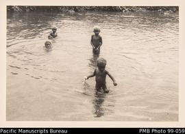 Children playing in a river