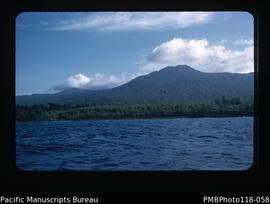 'En route to Paama. This is west coast of Ambryn in early morning. Volcano is on left.'