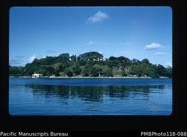'Iririki island from Vila wharf. Resident Commissioner lives on top. His boat shed visible. PMB [...