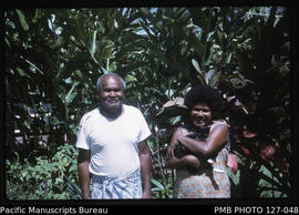 'Manuele and Asena (caretakers) and cat Doka in garden of 30 Beach Road, Suva, Fiji'