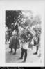 Cook Island men in costume (dresses, wreaths, etc) doing dance