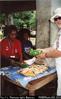 David Gowty buying our lunch – tuna and pumpkin in roti.  Lenakel market, Tanna