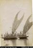 Crab-claw sail canoe (lakatoi) in water with people standing on board - PNG. Port Moresby (Duplic...