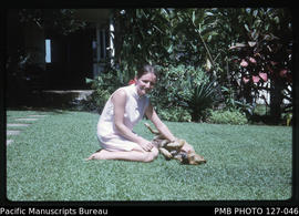 'Liz Baker and dog Smokey in the garden at 30 Beach Road, Suva, Fiji'