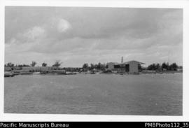 Manus [waterfront scene;  building, tower]