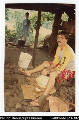 Richard Arbon scraping coconuts. Vaimoso, Upolu
