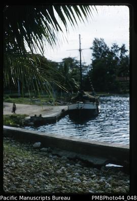 "At Madang wharf, note earthquake damage in foreground"