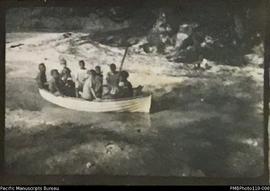 'The sand-larks', group of people in boat, Aulua, Malekula