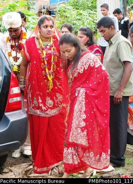 [Suva Wedding Savita taking a last sad look at her family home.  She is assisted by a bridesmaid,...