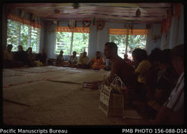 Visitors and their hosts assembled and addressed by a leading matai, Upolu, Samoa