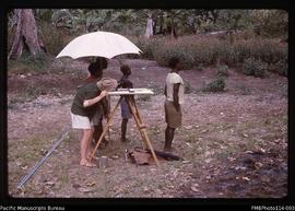 'Practising plane table surveying in Rove valley, John Baker VSO with Geology Dept staff, Honiara'